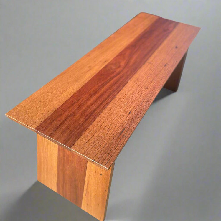 Wooden bench with a simple design on a gray background