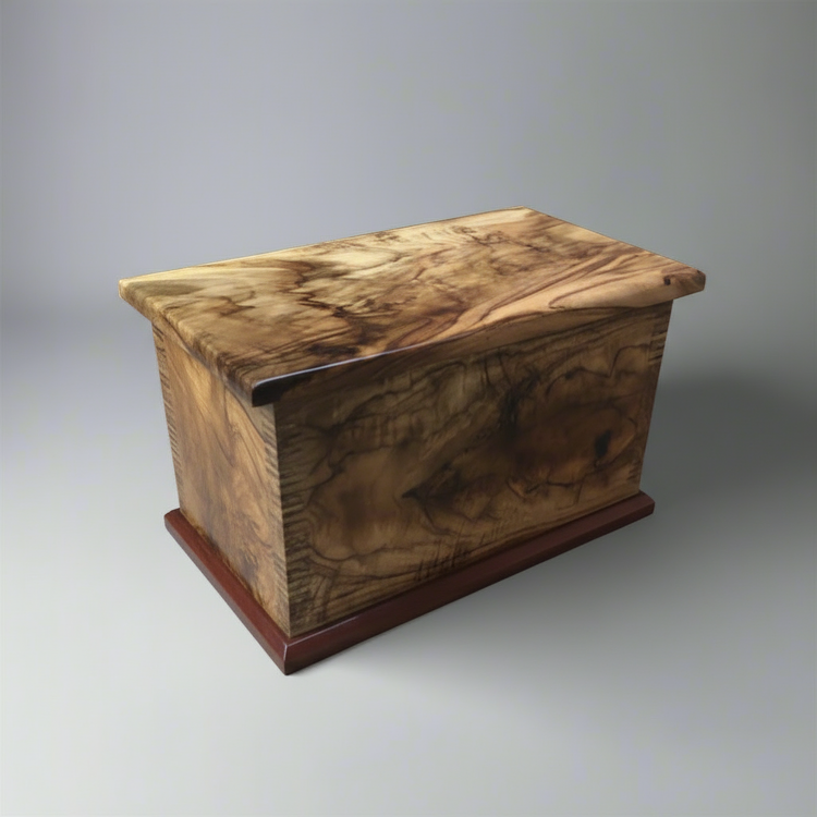 A custom made Camphor Laurel wood box with intricate detailing and a rich wood finish.