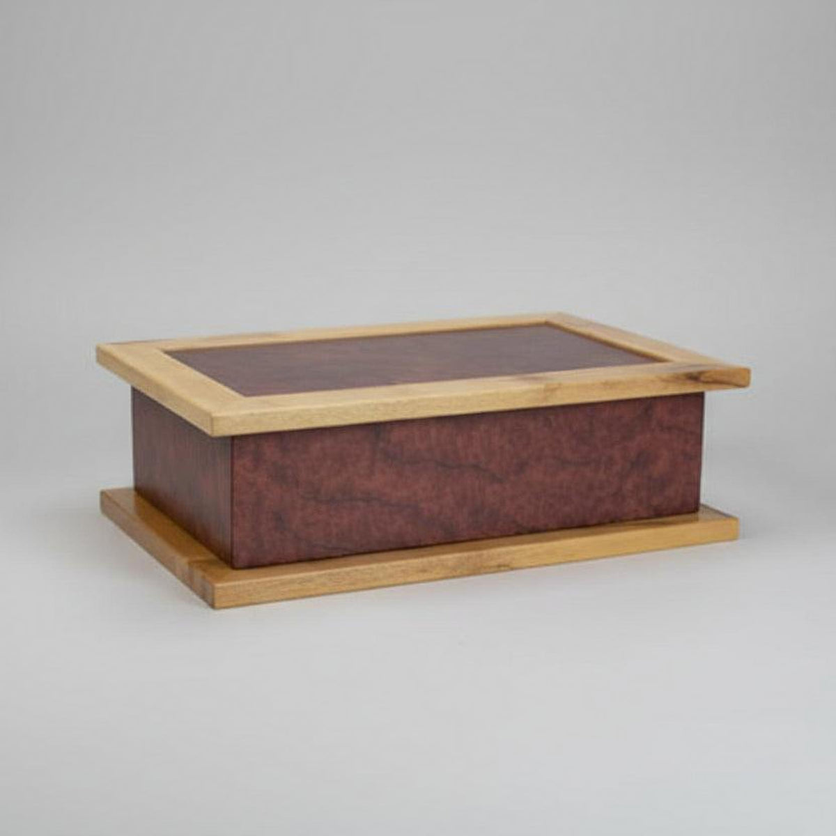 Wooden box with a glass lid on a wooden surface