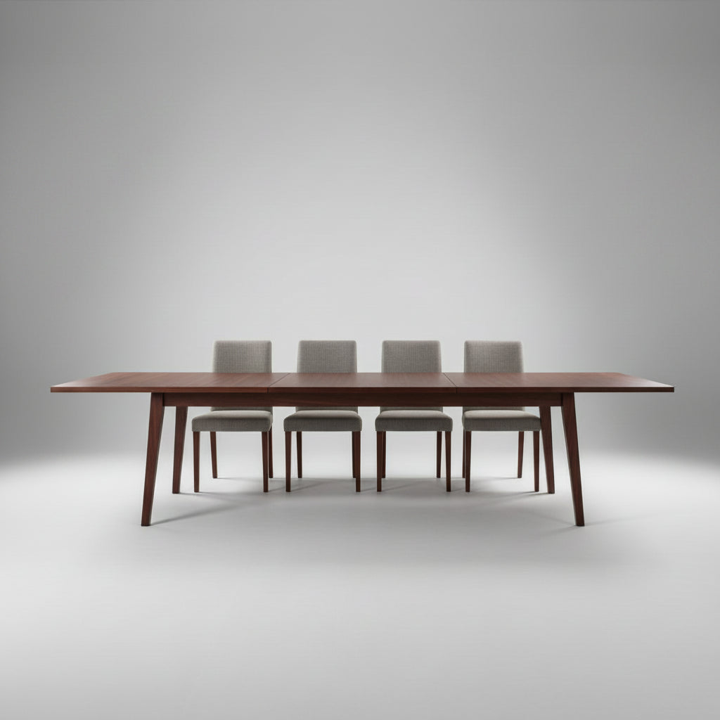 A long rectangular wooden conference table with a dark reddish-brown finish and slim legs, shown in a modern room with sheer curtains, four chairs, and a concrete floor.