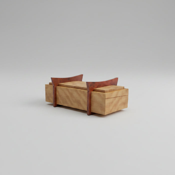Wooden jewelry box on a wooden surface with a dark background