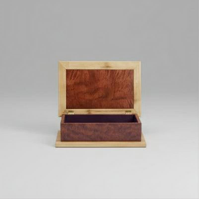 Wooden jewelry box with a mirror on a wooden surface