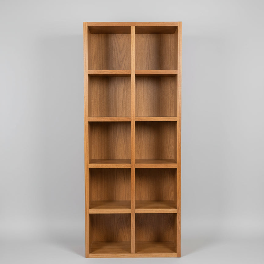 A Spotted Gum Pigeon Hole Unit with multiple shelves, featuring a backing and Spotted Gum beading on the front, placed in a showroom setting with various cushions on top.