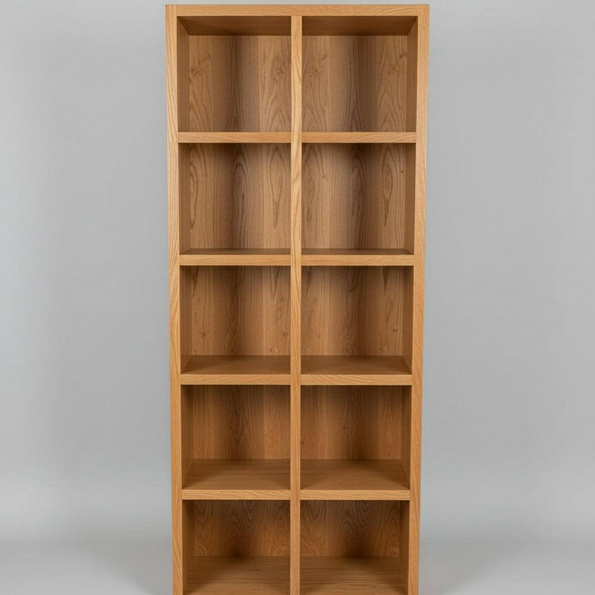 A Spotted Gum Pigeon Hole Unit with multiple shelves, featuring a backing and Spotted Gum beading on the front, placed in a showroom setting with various cushions on top.